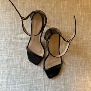 Stuart Weitzman Nudistcurve 100 Sandal Black Patent Leather Strappy Heel